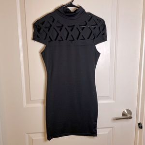 Black cut-out dress. Size S. Never worn. Stretchy. Fitted dress.